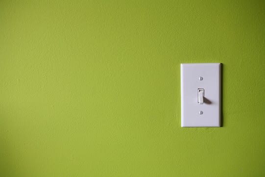 light-switch-in-front-of-green-background-91448627-57fe9fe35f9b5805c271843c